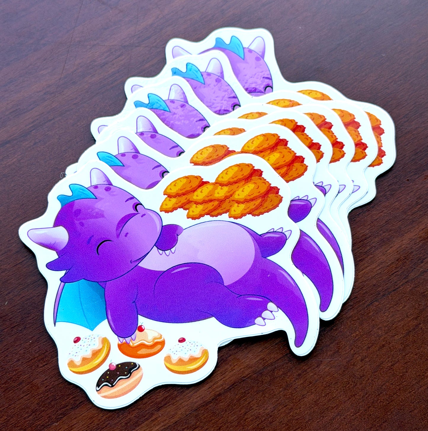 Sticker: Sleepy dragon with latkes and sufganiyot